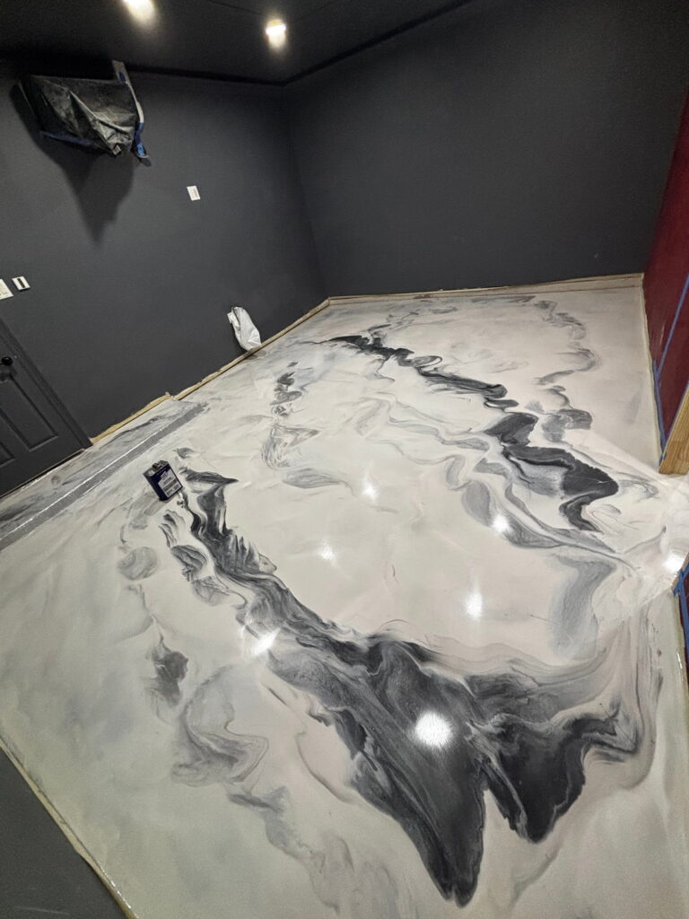 Black and yellow metallic epoxy flooring in San Antonio, TX
