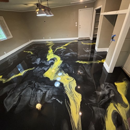 Black and yellow metallic epoxy garage flooring in San Antonio, TX
